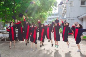 Graduate Students throwing their mortarboards