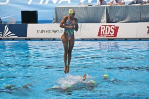 Woman Jumping Out of the Water