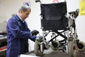 Engineer fixing a Wheelchair